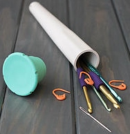 Yarn winder tube with innner storage shown.